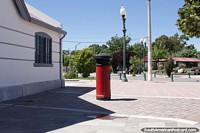 Antique red post box beside the Regional Museum Pueblo de Luis in Trelew. Argentina, South America.