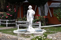 White statue and fountain at the Pavon Island administration center in Piedrabuena.