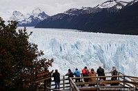 Larger version of People enjoy amazing views of Perito Moreno Glacier, a huge ice sheet.