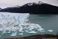 Large chunks of ice float after falling off Perito Moreno Glacier.