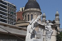 Military figures of the flag monument and cathedral in Rosario. Argentina, South America.