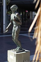 Larger version of Bronze work of a man in the street in Resistencia, the city of art, sculptures and statues.