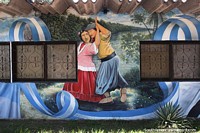 Hermoso mural de un hombre y una mujer bailando con traje tradicional en Resistencia. Argentina, Sudamerica.