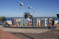 Corrientes spelled out in big colorful letters in front of the Parana River.