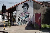 Larger version of Hat lady with birds, an urban piece of street art in Santa Cruz.