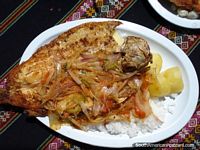 Fresh trout for lunch at Lago Titicaca for 20 Bolivianos! Bolivia, South America.