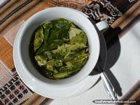 A real cup of coca tea with leaves. Bolivia, South America.
