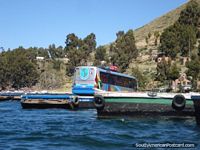 Bus on a barge in San Pedro de Tequina on route from Copacabana to La Paz. Bolivia, South America.