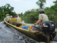 A tour group on the river in the Rurrenabaque pampas. Bolivia, South America.