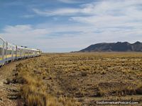 The train heads for Uyuni from Oruro. Bolivia, South America.