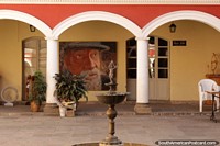 Larger version of View of the fountain and large painting at the Writers Museum Augusto Guzman in Cochabamba.