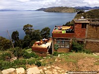 Sit down and have refreshments while enjoying spectacular views of Lake Titicaca, Island of the Sun, Copacabana. Bolivia, South America.