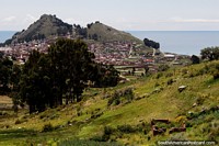 Copacabana with Cerro Calvario (hill) and Lake Titicaca, view from the distance. Bolivia, South America.