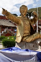 Gold monument of Don Eduardo Abaroa (1838-1879) pointing out to the Tiquina Strait between Copacabana and La Paz, a war hero. Bolivia, South America.