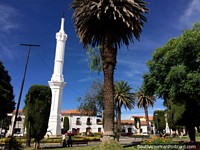 The Obelisco, tall white column at Plaza Libertad in Sucre. Bolivia, South America.