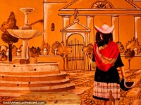 Beautiful orange mural of a woman near a fountain and tall columns, Sucre. Bolivia, South America.