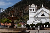 Plaza Pedro de Anzurez with stone fountain and white church, Recoleta, Sucre. Bolivia, South America.