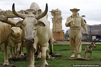 Man with his plowing cows and loyal dog, monument in Cobija. Bolivia, South America.