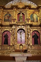 Golden altar, religious figures and paintings, the church inside La Casa de Moneda in Potosi. Bolivia, South America.