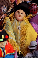 Hat lady doll, she wears a yellow shawl, souvenirs at Tarabuco market. Bolivia, South America.