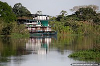 Bolivia Photo - A beautiful and large boat on the tranquil waters with nice scenery around Trinidad.