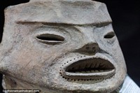 Ceramic mask with small holes dotted around the mouth, archeology at Kenneth Lee Museum in Trinidad. Bolivia, South America.