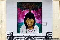 Indigenous man with a tree behind him, painting called The Last Pacahuara by W. Santiago Toro in Santa Cruz. Bolivia, South America.
