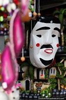 Black and white wooden mask with rosy cheeks, crafts for sale in central Santa Cruz. Bolivia, South America.
