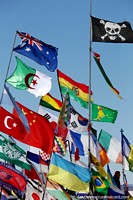 Many flags of the world flying in the wind at the Uyuni salt flats, can you see yours? Bolivia, South America.