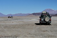 Jeeps on tour in the Uyuni desert, each jeep has 6 people plus the driver, day 2 is to the mountains and lagoons. Bolivia, South America.