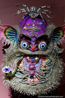 Bearded purple monster with spiders on his head and chin, Moreno mask from 1970 at the Anthropological Museum in Oruro. Bolivia, South America.