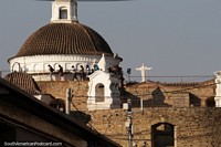 Dome of the cathedral and the huge Jesus statue on a distant mountain in Cochabamba. Bolivia, South America.