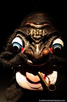 Caporal, with big eyes and a pipe, plaster cast mask from the La Paz region, Musef museum, La Paz. Bolivia, South America.