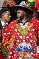 Bolivia Photo - An outfit of red featuring snowy mountains, fine costumes at the El Gran Poder parade in La Paz.