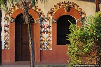 Nice facade with arches with painted designs and patterns beside the cathedral in San Ignacio de Velasco.