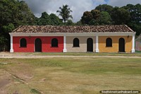 Colorful row of houses and grassy lawn in the historic center of Porto Seguro.