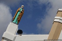 Religious figure holding keys and dressed in robes at the Sanctuary Basilica of Our Lady of Sorrows in Juazeiro do Norte.