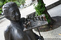 The lady with the candle holder for special occasions in the Sao Luis historic center.