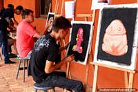 People paint pictures of archaeological relics inside Forte do Presepio in Belem. Brazil, South America.