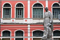 Larger version of The pink facade of the O-Cosmorama building and statues in Belem.