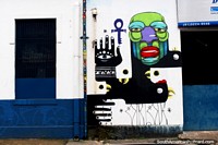 El hombre con una cabeza verde y grandes labios rojos, mural de la pared en Belem. Brasil, Sudamerica.