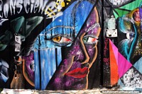 Fantastic mural in purple and blue, lady with piercing eyes, Beco do Batman, Sao Paulo. Brazil, South America.