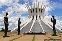 Larger version of Metropolitan Cathedral in Brasilia, star-shaped dome and statues outside.