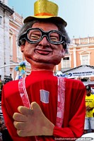 Character with glasses and a top-hat, munecos roam the streets of Salvador.