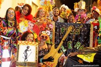 An extremely dressed-up and colorful group of people enjoying the carnival in Salvador. Brazil, South America.