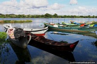 River canoes moored in Penedo on the Sao Francisco River, calm waters. Brazil, South America.
