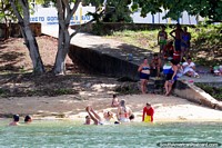 People swimming and having fun in the river in Neopolis near Penedo. Brazil, South America.