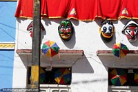 Carnival faces and umbrellas, decorated homes in Olinda. Brazil, South America.