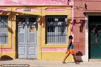 Larger version of Wooden window shutters and doors, pastel colored houses in Olinda.