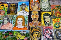 These paintings of faces are sold on the street on the hilltop in Olinda. Brazil, South America.